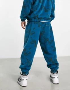 Actual Co-Ord Relaxed Polar Fleece Joggers With All Over Print And Applique Logo In