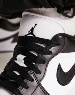 Jordan Aj1 Low Trainers In And Black
